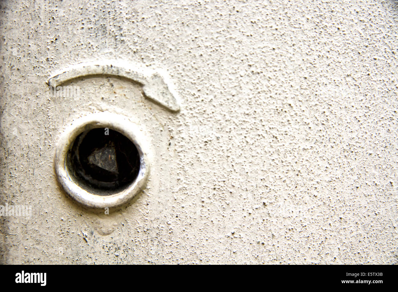 Keyhole for the door lock of an exterior electricity meter cupboard Stock Photo