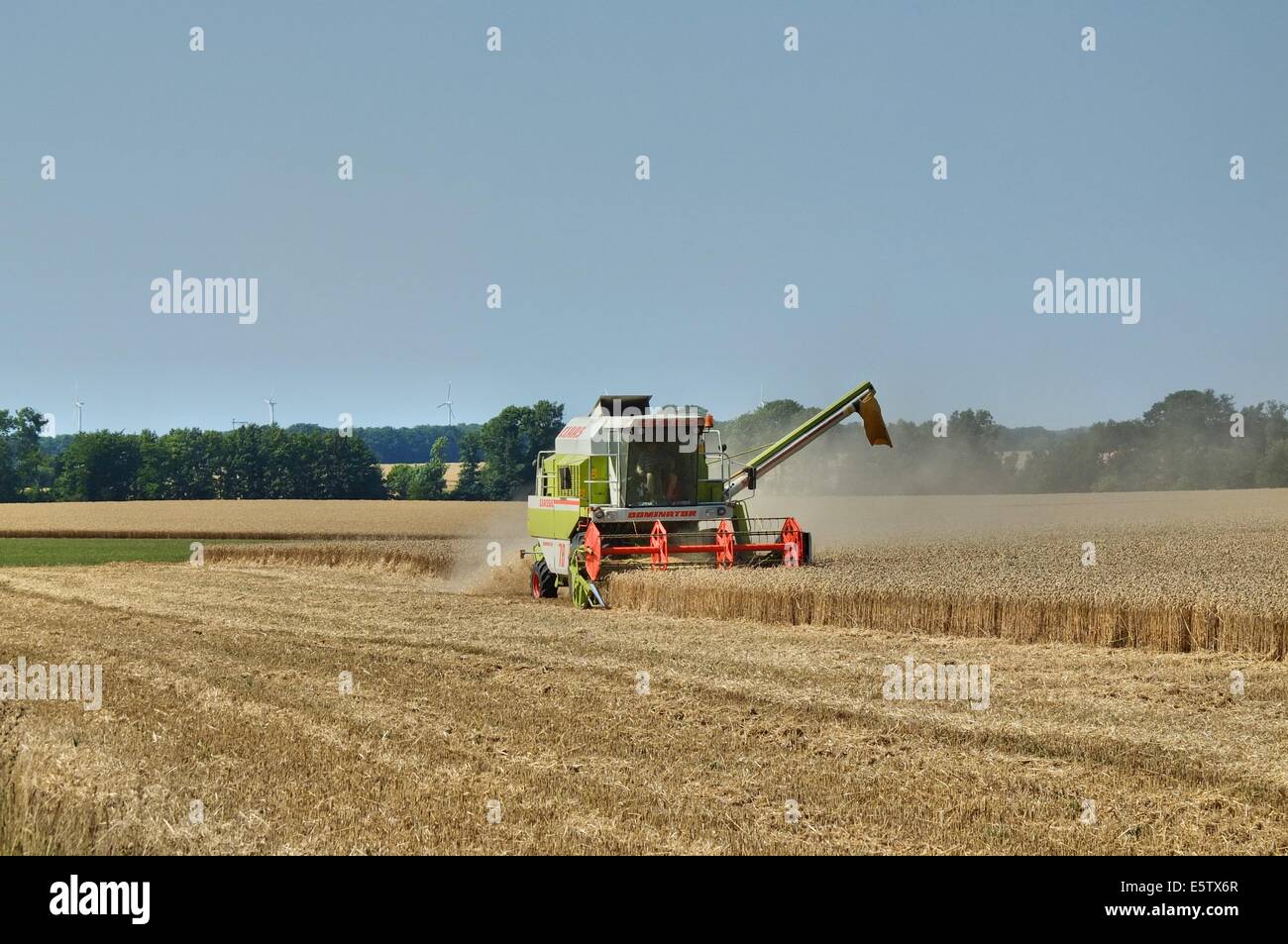 Denmark, Bornholm Island 1st - 4th, August 2014 Farmers during the harvesting process on the Bornholm Island. Agriculture is one of a major sector of the economy of the Bornholm Island. Stock Photo