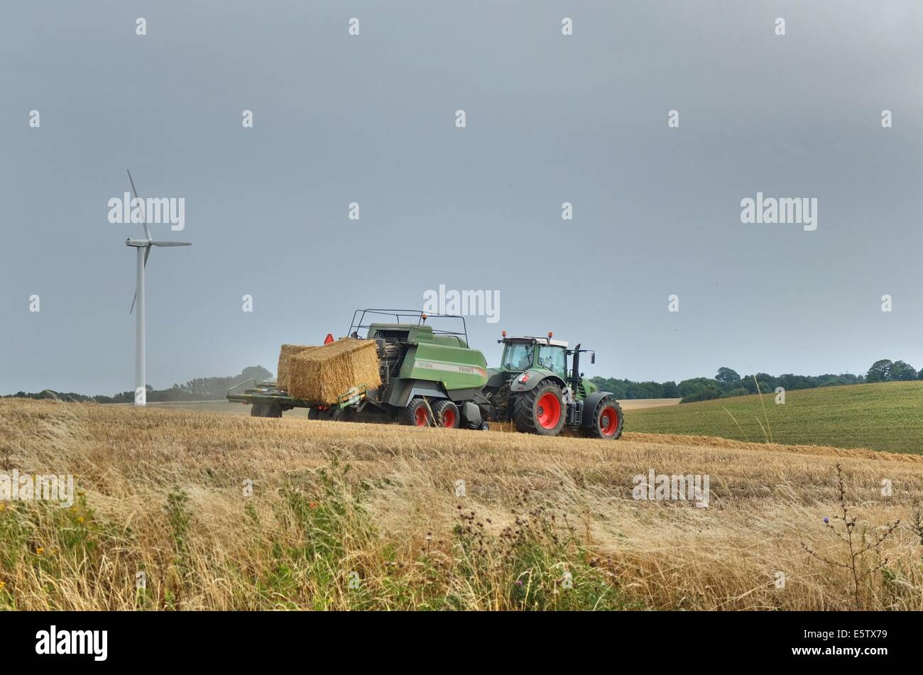 Denmark, Bornholm Island 1st - 4th, August 2014 Farmers during the harvesting process on the Bornholm Island. Agriculture is one of a major sector of the economy of the Bornholm Island. Stock Photo