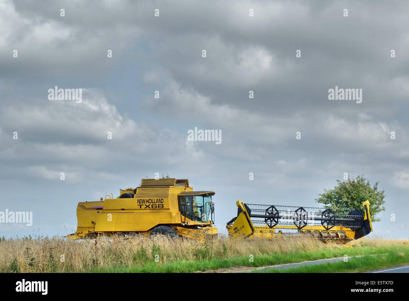 Denmark, Bornholm Island 1st - 4th, August 2014 Farmers during the harvesting process on the Bornholm Island. Agriculture is one of a major sector of the economy of the Bornholm Island. Stock Photo