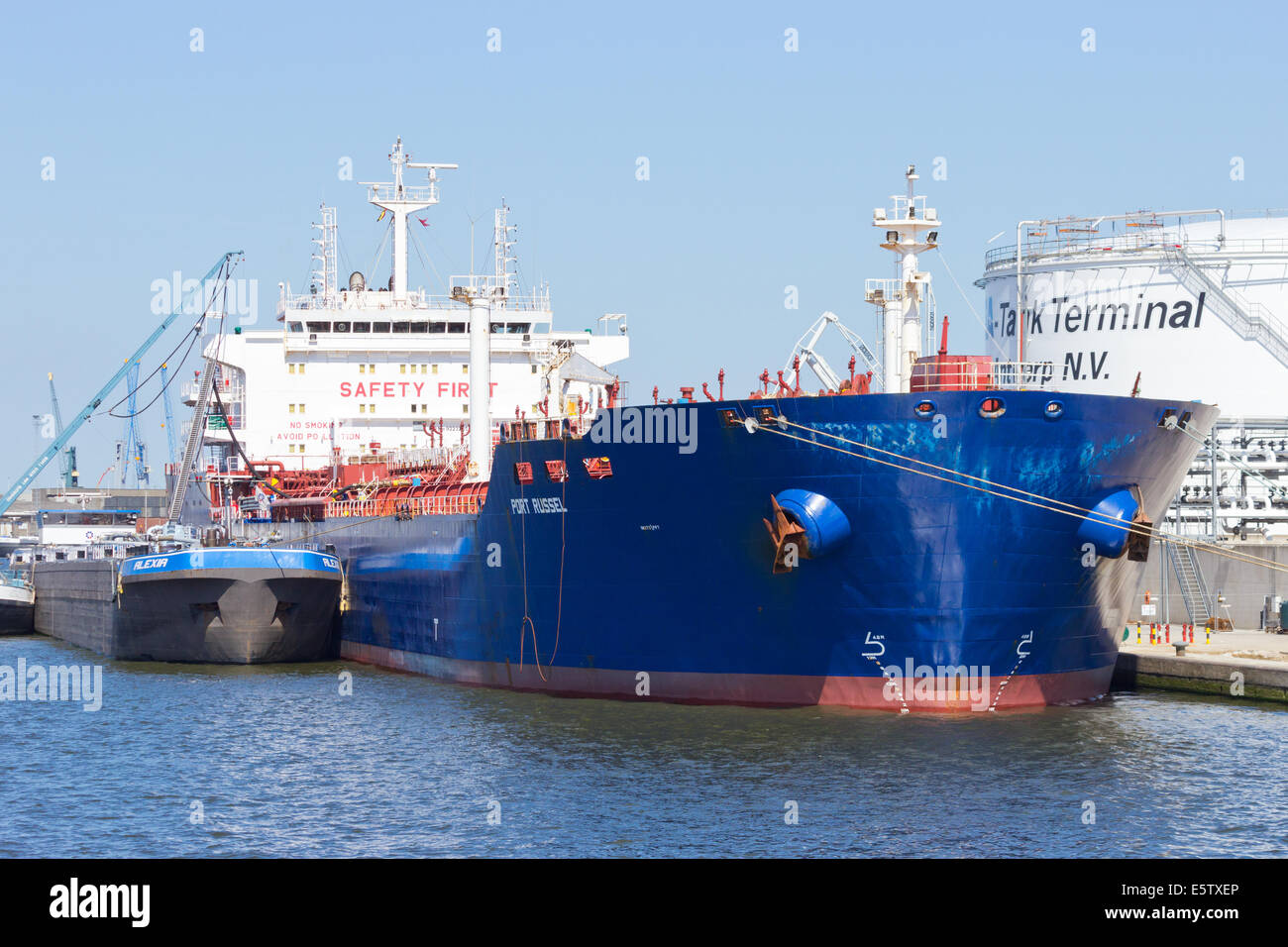 Oil tanker moored near an oil silo in Port of Antwerp July 9,2013 in Antwerp. Stock Photo