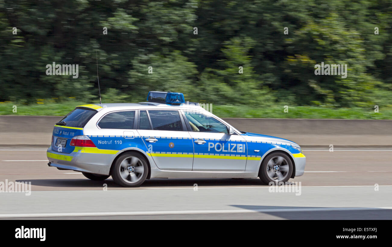 German police car on the autobahn near Frankfurt. Stock Photo