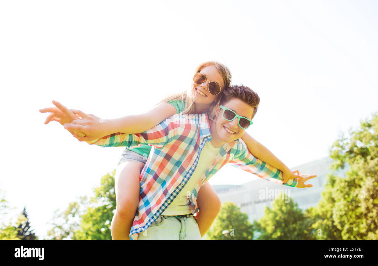 smiling couple having fun in park Stock Photo - Alamy