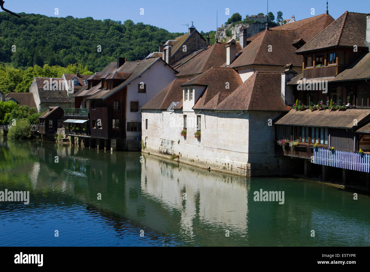 The river town of Ornans along the Loue, in Doubs Jura Mountains in the region of Franche Comté Stock Photo