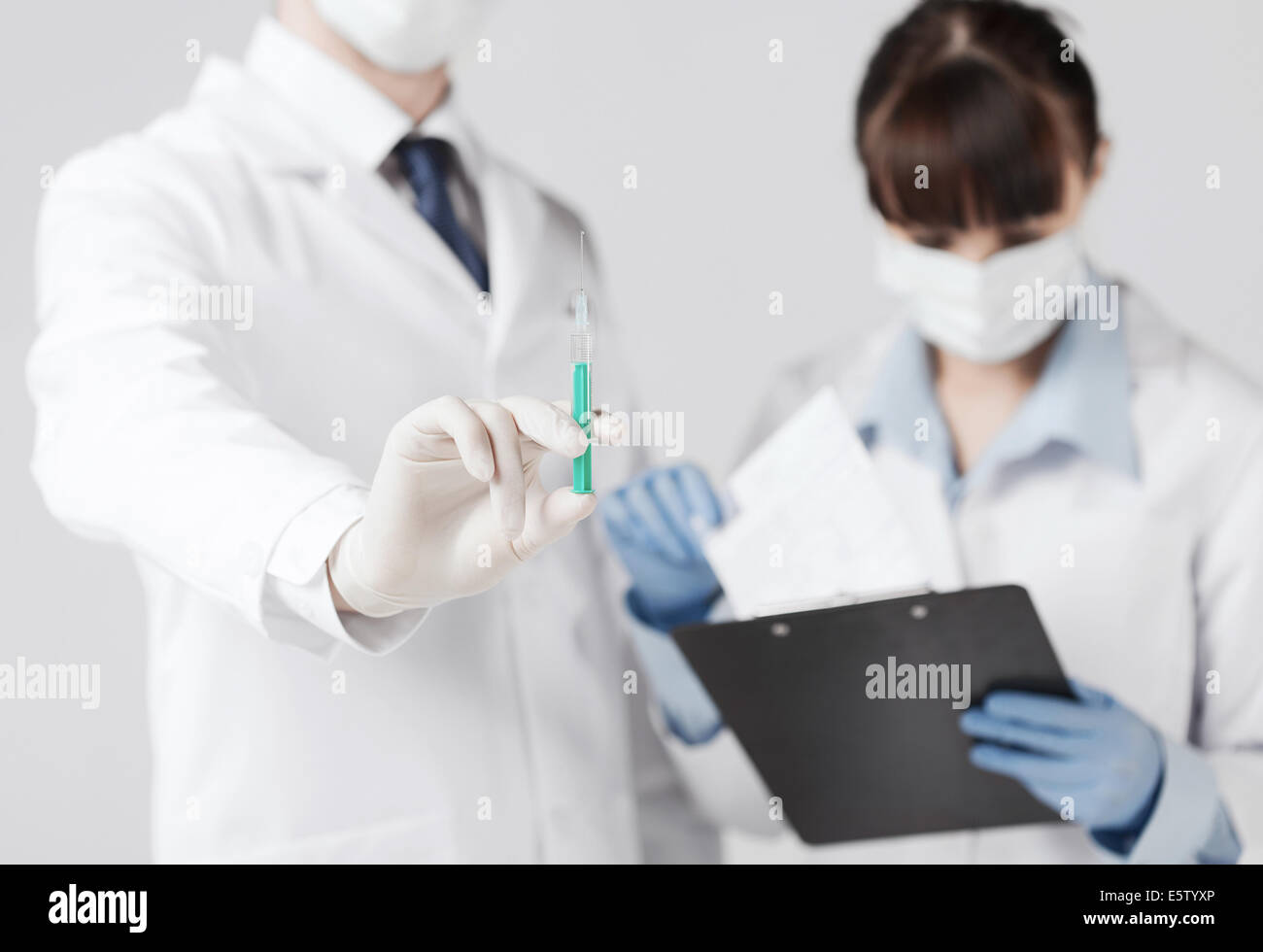 doctors with syringe Stock Photo Alamy