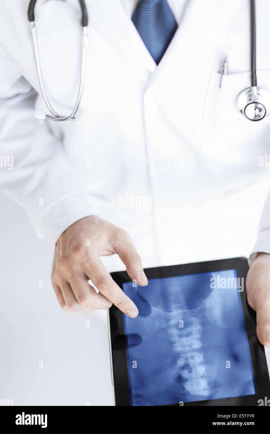 male doctor holding tablet pc with x-ray Stock Photo - Alamy