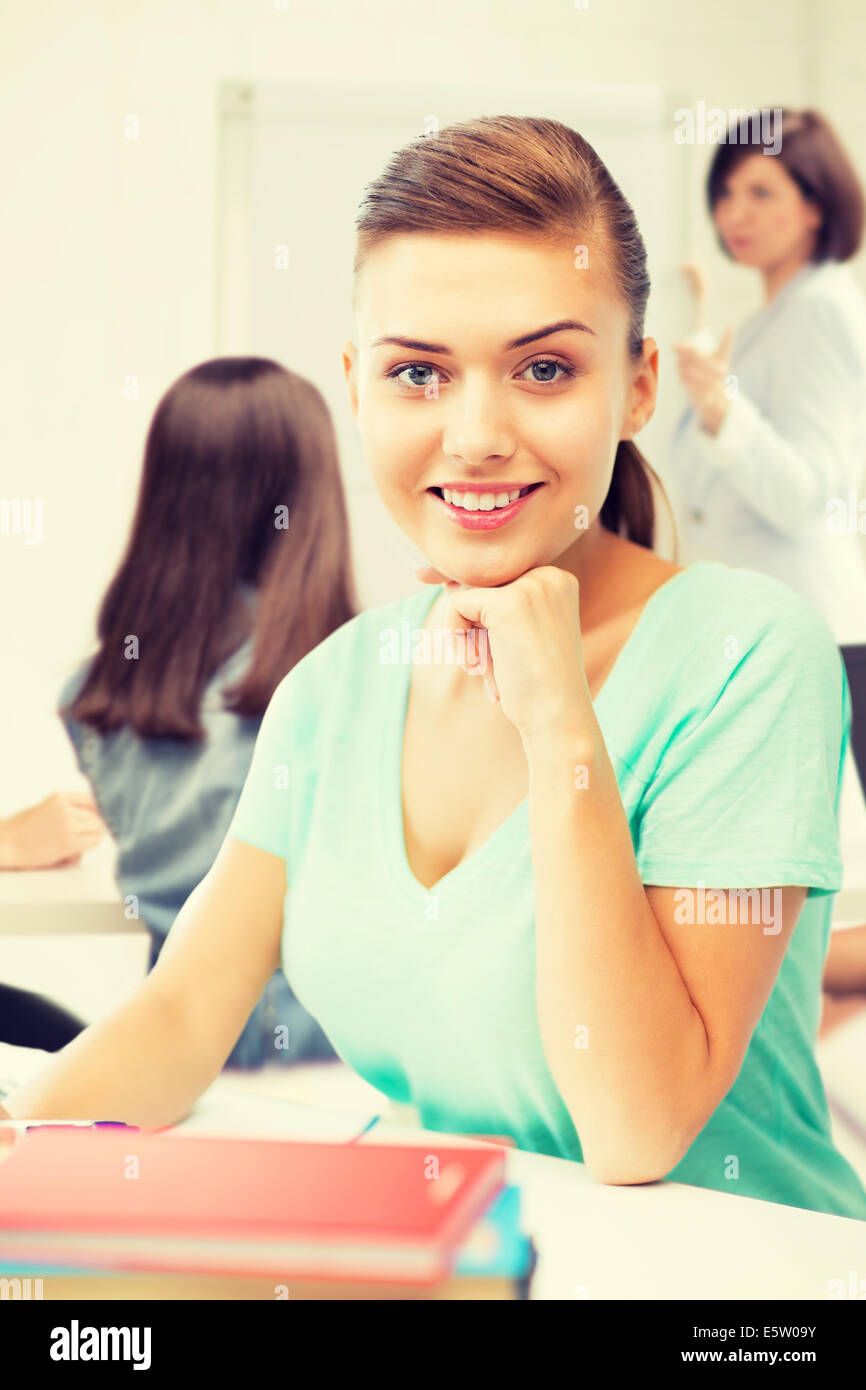 happy smiling student girl with books at school Stock Photo - Alamy