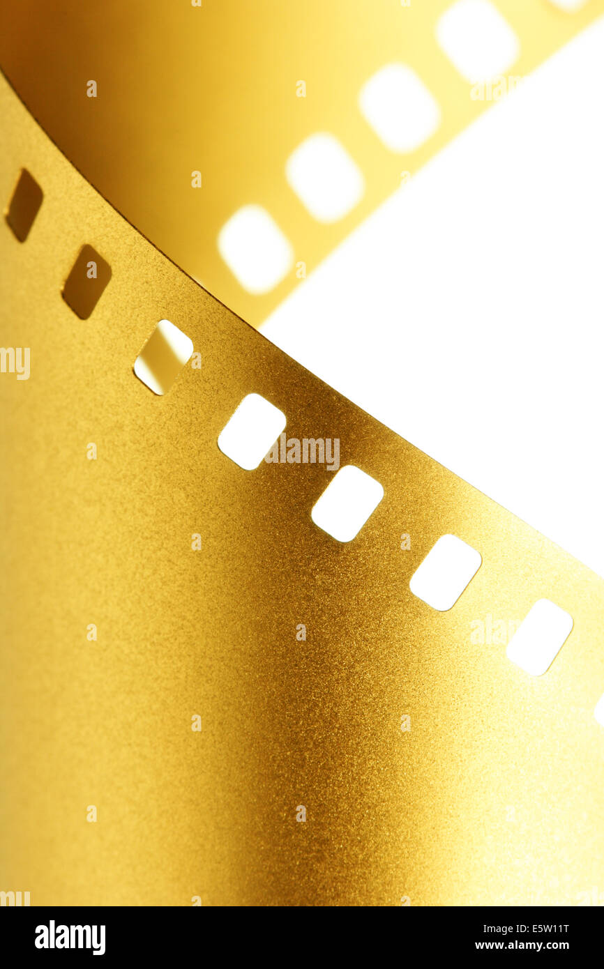 Gold 35 mm film macro isolated over white background Stock Photo