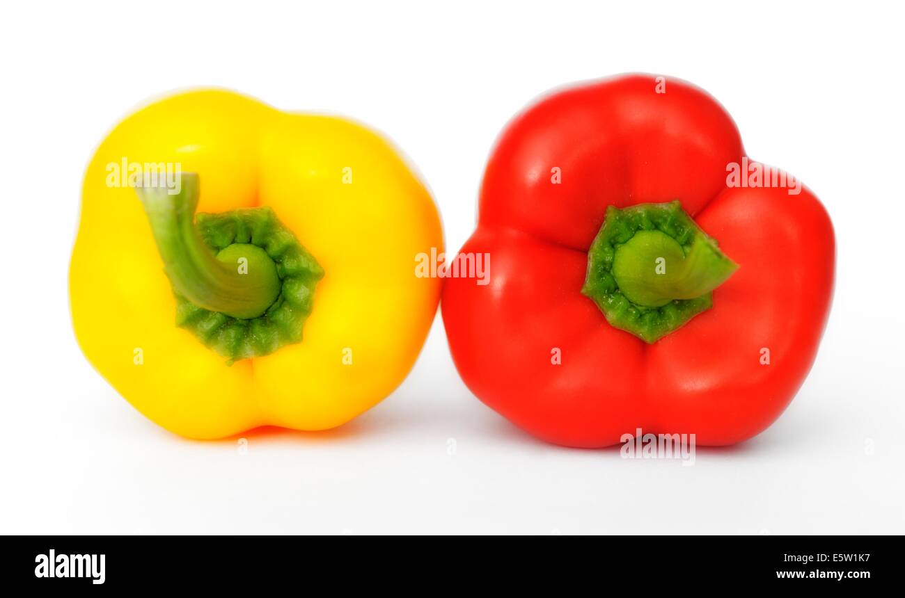 A red and yellow pepper on a white background Stock Photo - Alamy