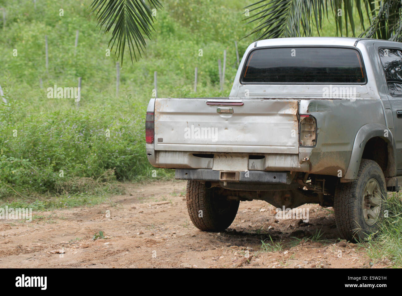 Rear of old pickup through the use heavily. Stock Photo