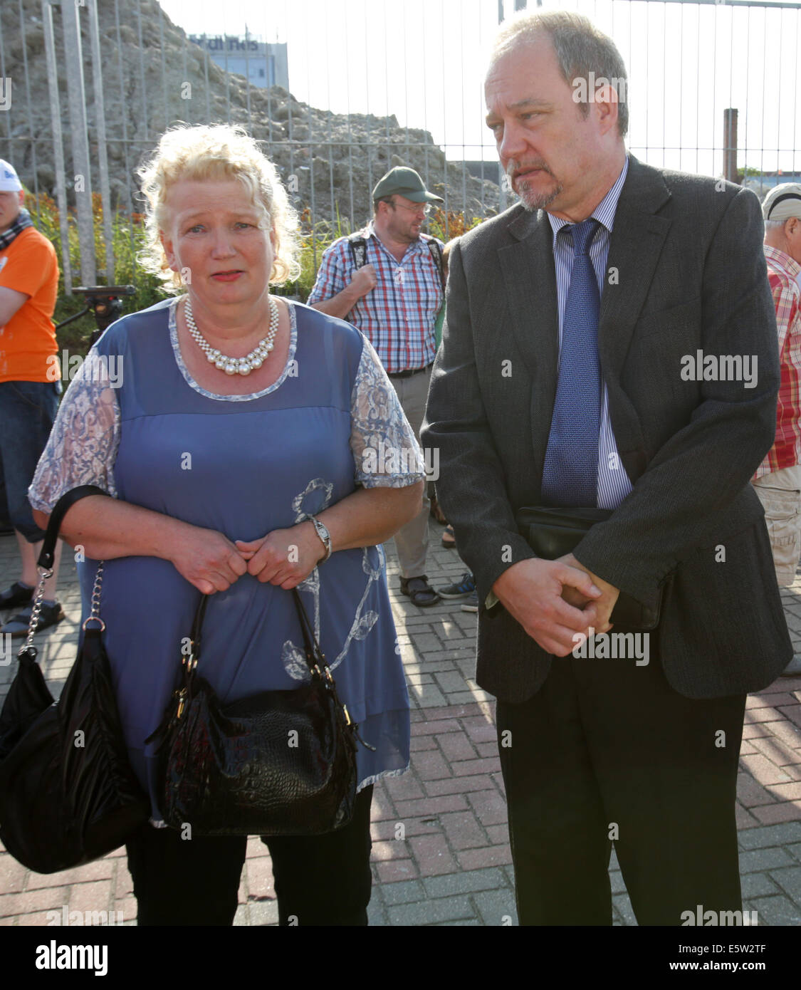Rostock-Warnemuende, Germany. 06th Aug, 2014. The parents of Jenny Boeken, who was killed in an accident on board of the 'Gorch Fock', Marlis and Uwe Boeken, stand at the passenger quay in Rostock-Warnemuende, Germany, 06 August 2014. Representatives of the administrative court Aachen are going to investigate on site if there was a particular danger of life during the service practice. The parents claimed for indemnification of 40,000 euros from the Federal Republic of Germany. Photo: Bernd Wuestneck/dpa/Alamy Live News Stock Photo
