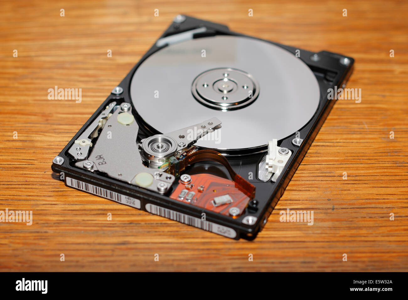 Opened hard drive showing disc platter. Stock Photo