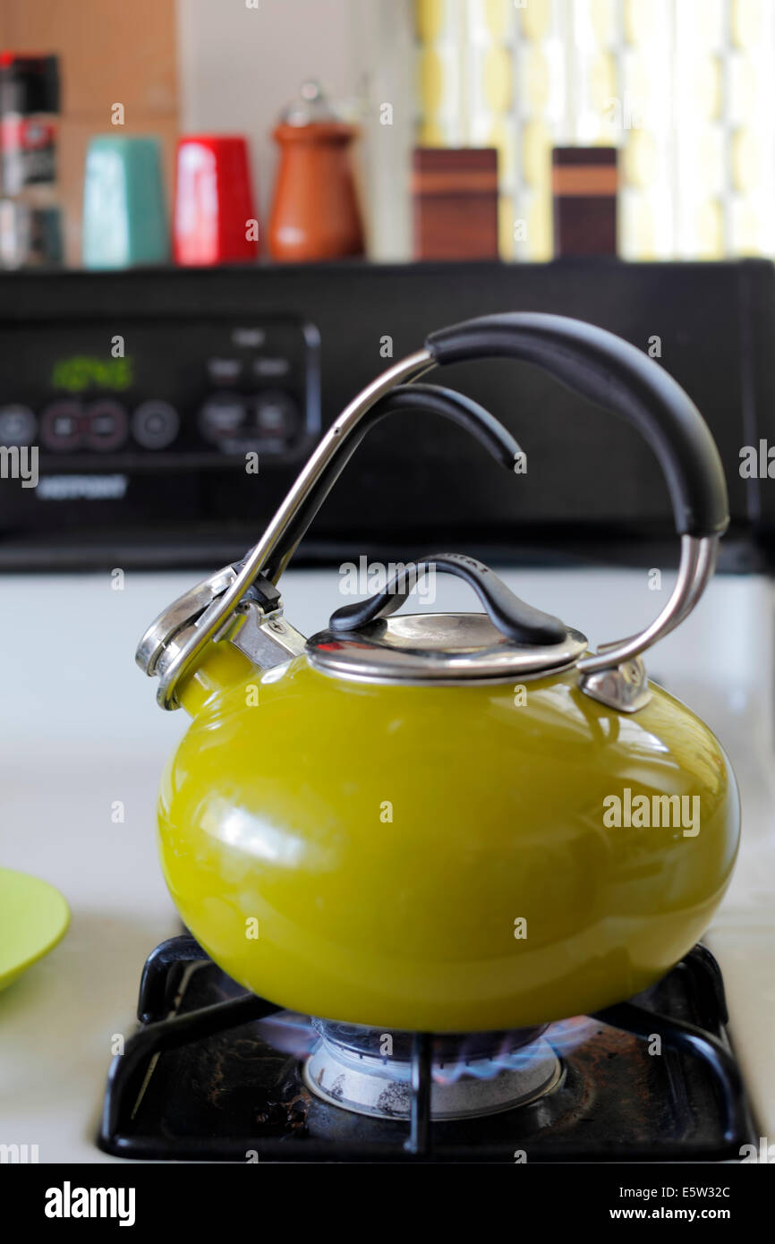 Green teapot on stovetop Stock Photo Alamy