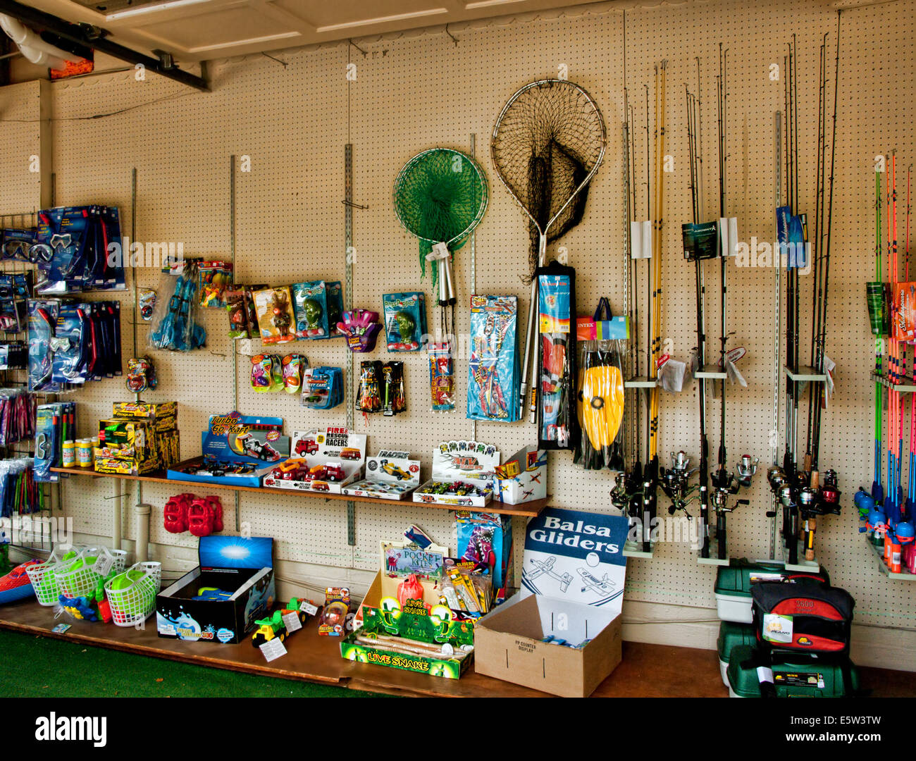 fishing equipment for sale at an outdoor market Stock Photo - Alamy