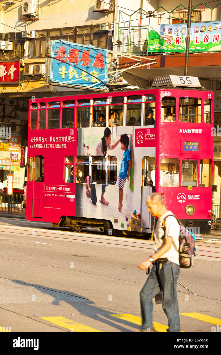 Morning Commute. A Vintage Tram On The Kings Road, Fortress Hill, Hong Kong. Stock Photo