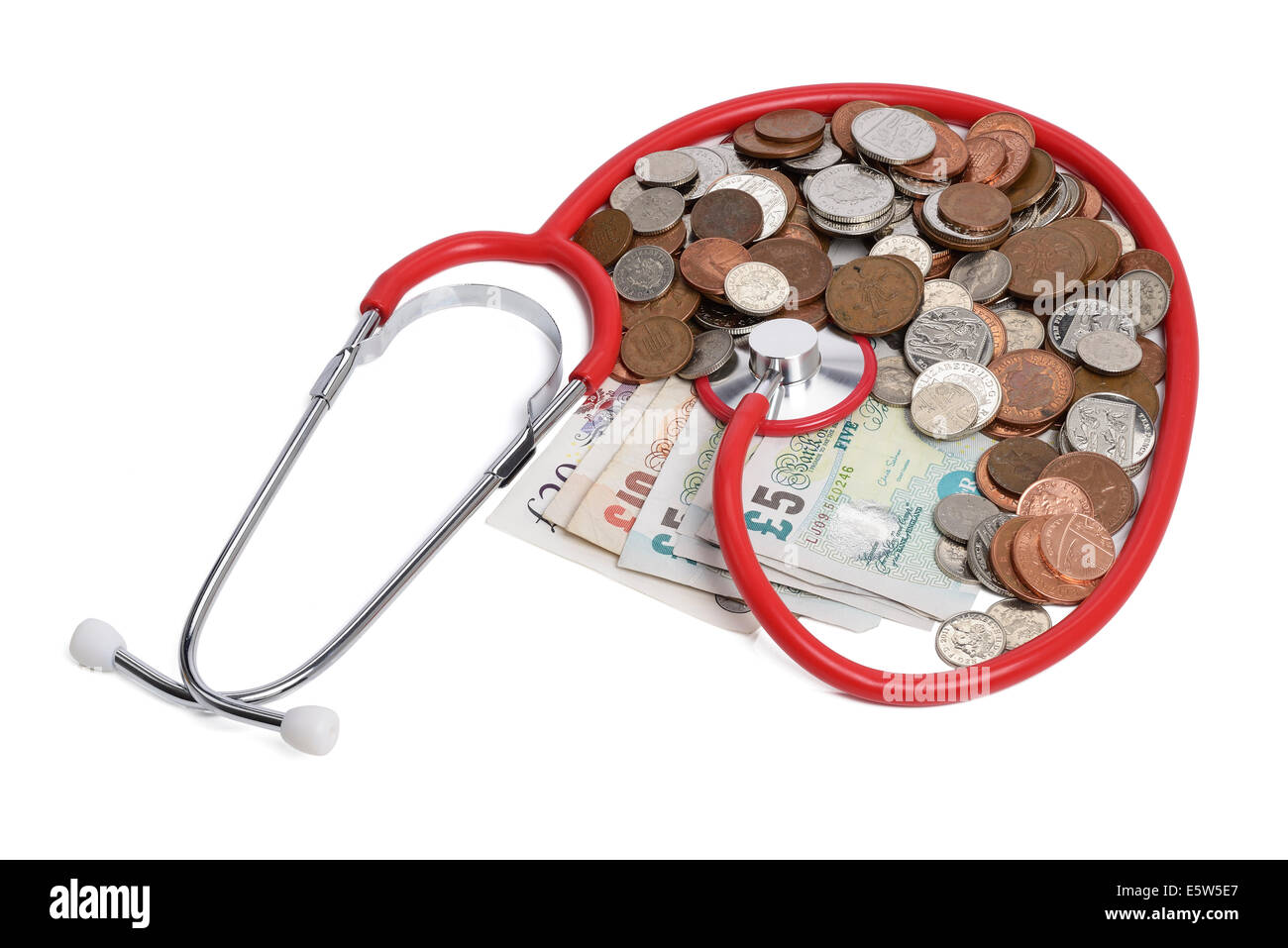 A stethoscope and a pile of money Stock Photo