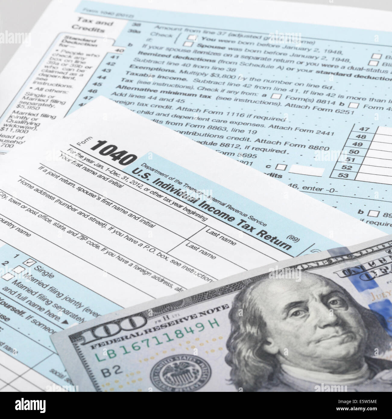 100 dollar bills 1040 tax hi-res stock photography and images - Alamy