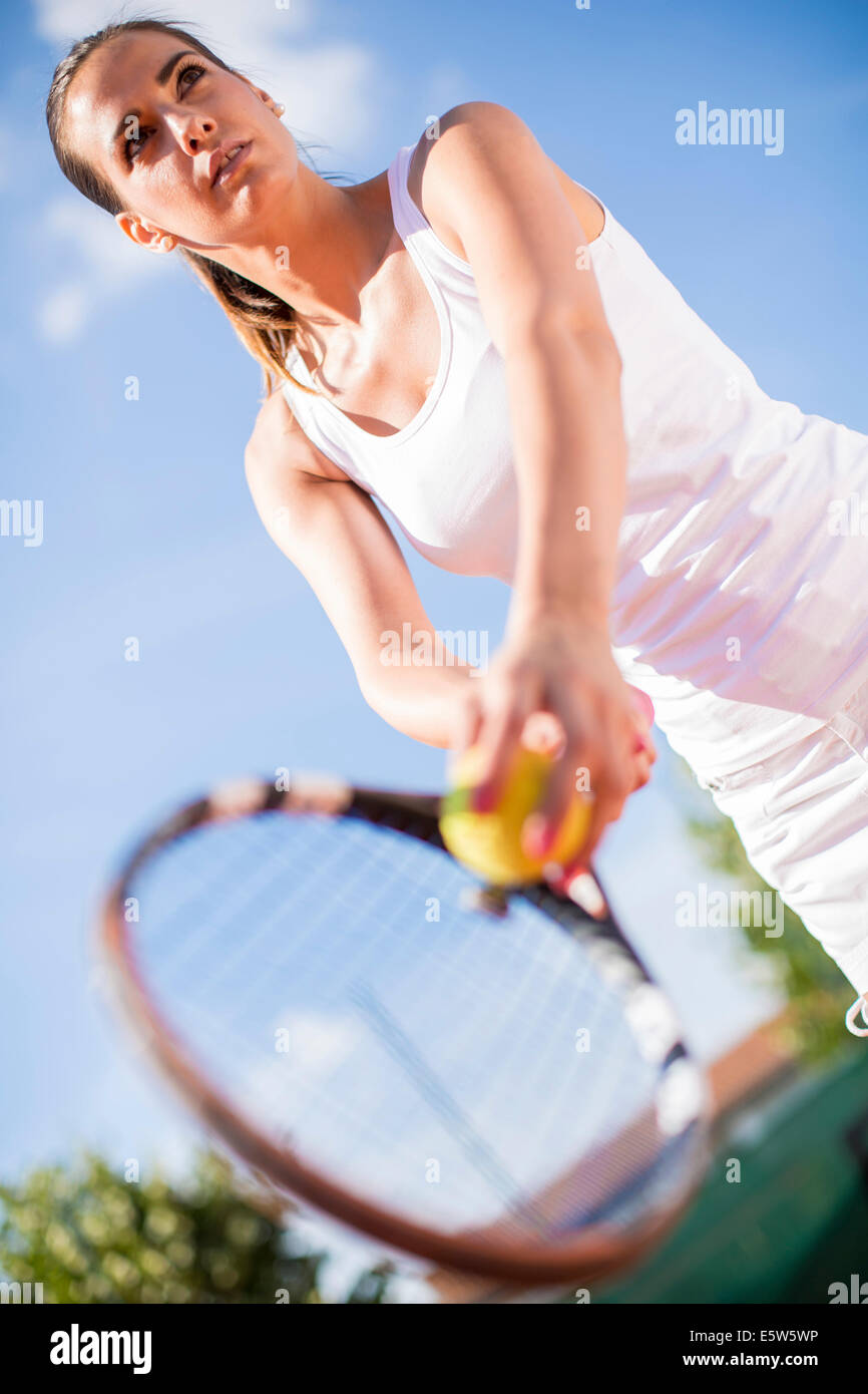 Young woman playing tennis Stock Photo