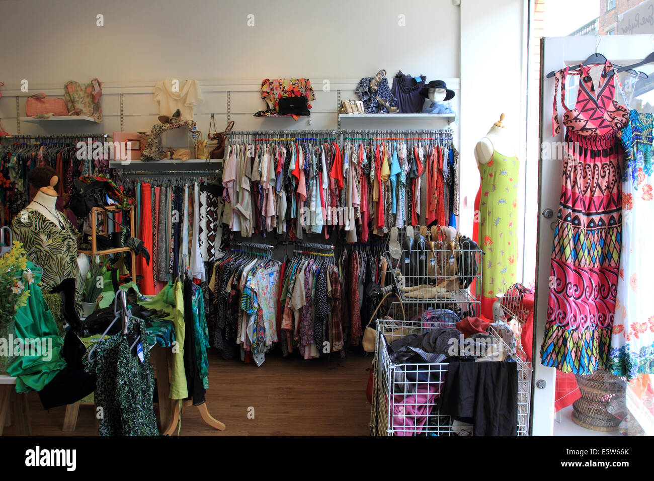 Second hand cloths on rails at Charity shop, Sue Ryder, Great Yarmouth,Norfolk,UK Stock Photo