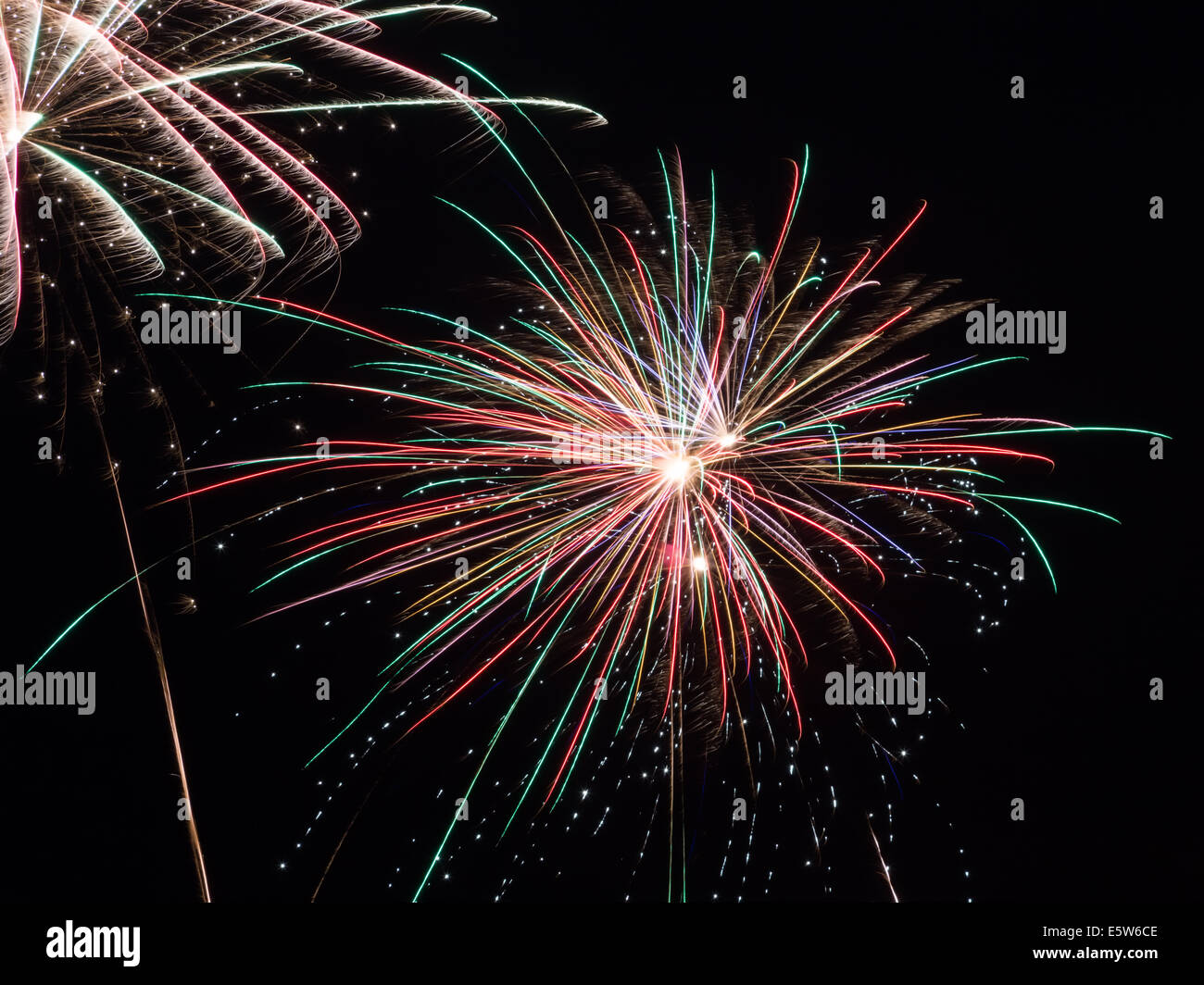 Beautiful multi-colored fireworks exploding in the night sky. Stock Photo
