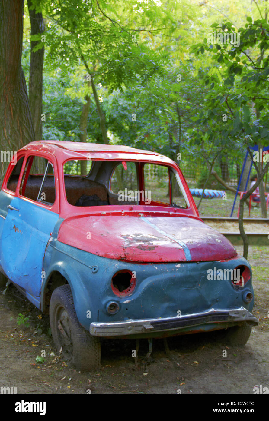 stationary old car in garden Stock Photo Alamy
