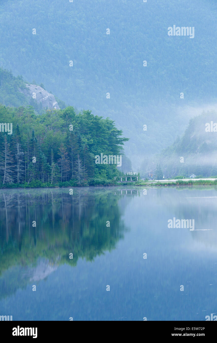 Reflection of Elephant Head rock profile in Saco Lake at the start of Crawford Notch State Park in the White Mountains, NH Stock Photo