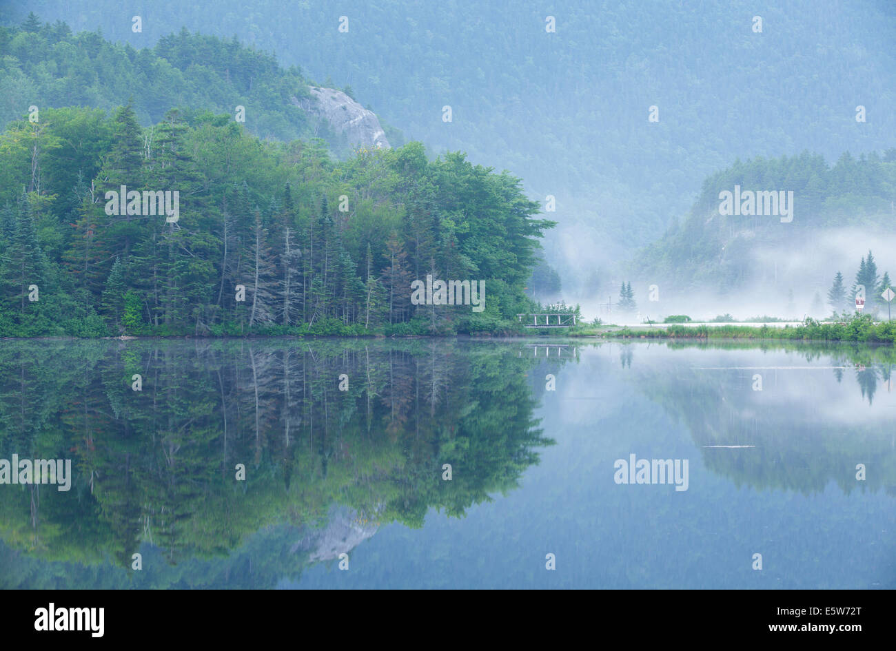 Reflection of Elephant Head rock profile in Saco Lake at the start of Crawford Notch State Park in the White Mountains, NH Stock Photo