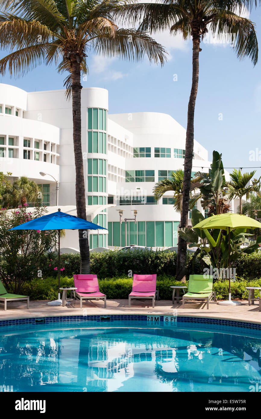 Miami Beach Hotel Pool with sun loungers and umbrellas Stock Photo