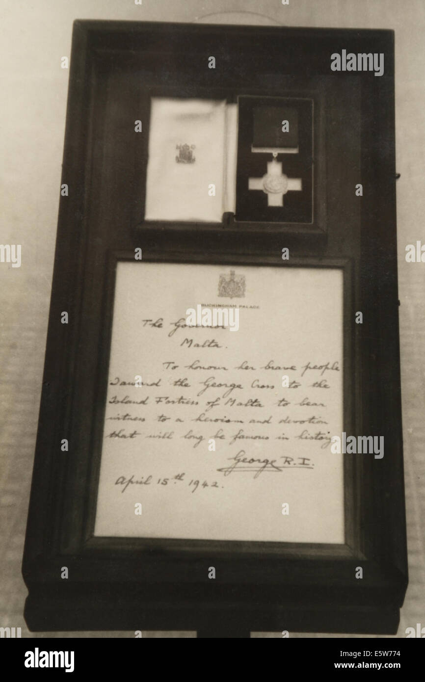 George Medal and King George VI citation in display case standing Palace Square, Valletta, Malta, September 1942 Stock Photo
