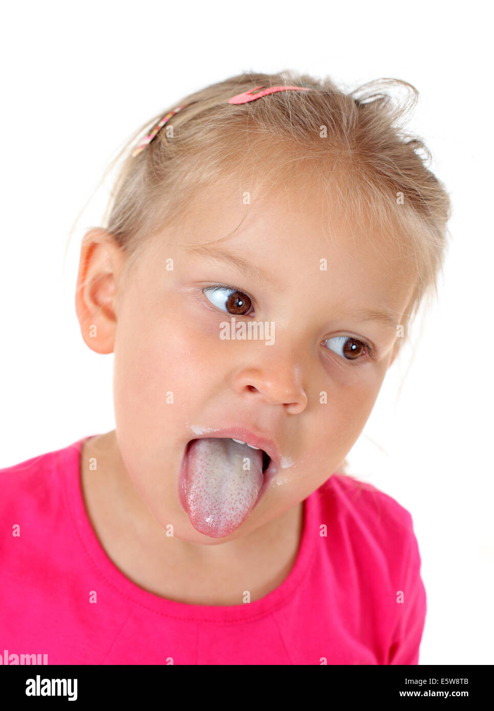 Little girl showing her milk tongue Stock Photo