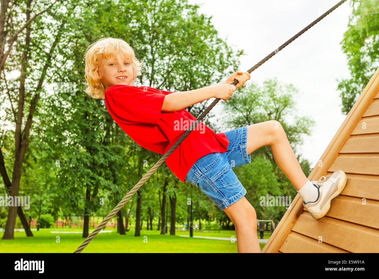 Boy Using A Rope Boy balancing rope hi-res stock photography and images - Alamy
