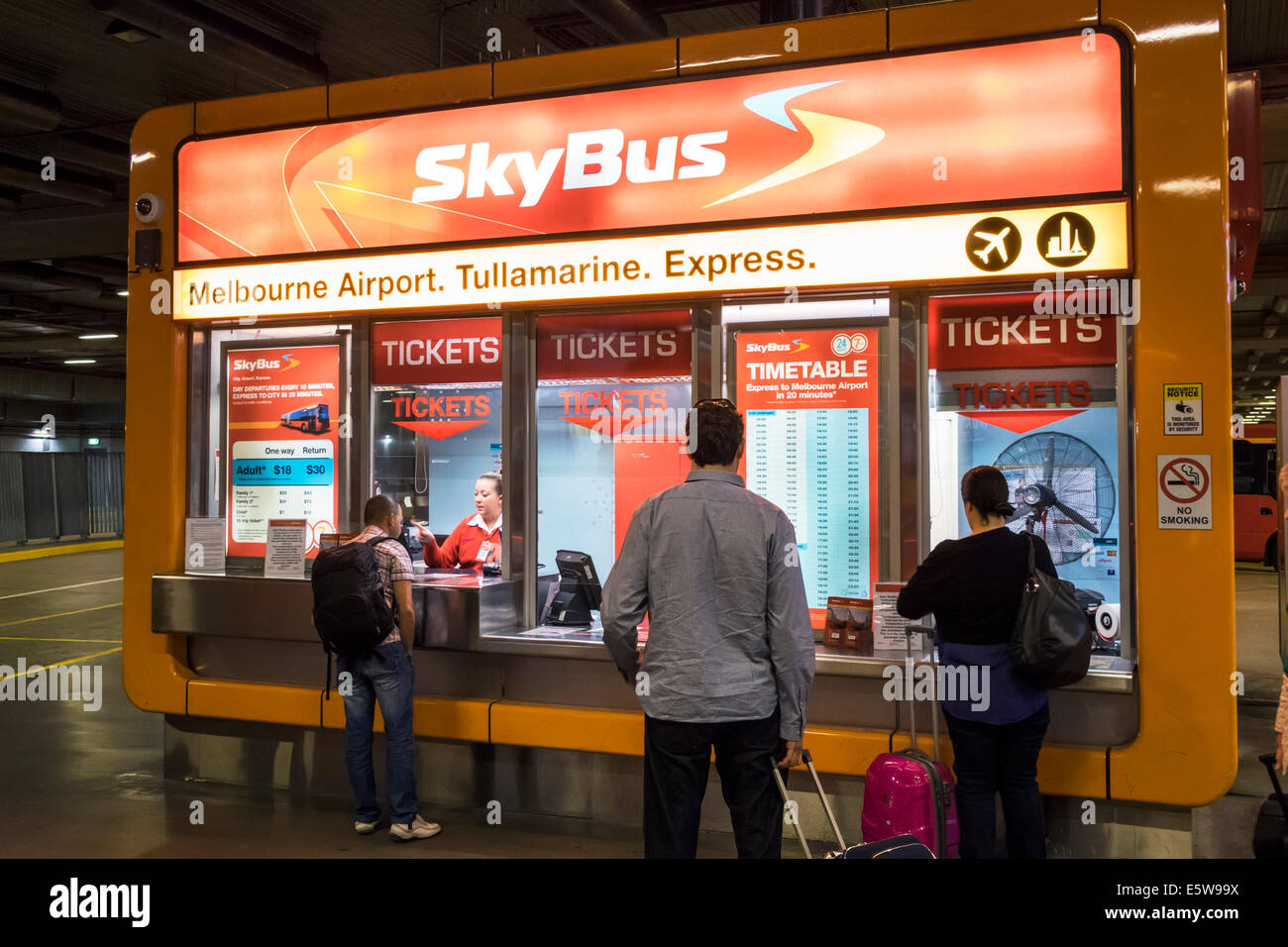Melbourne Australia,Southern Cross Station,SkyBus,ticket window,booth,customers,transaction paying pays buying buys,airport bus,coach,AU140323004 Stock Photo