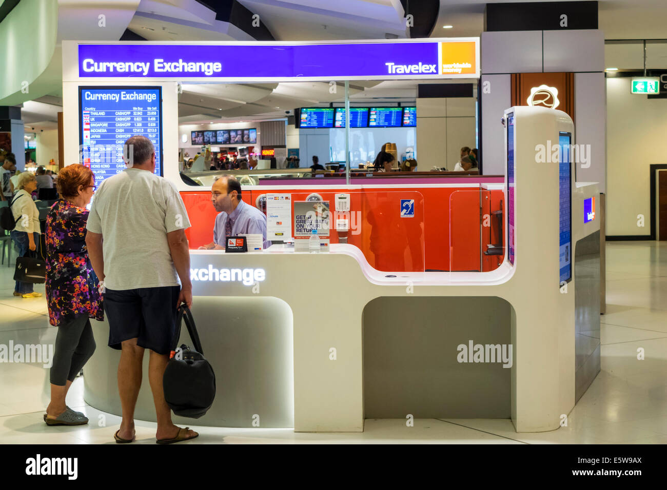 Sydney Australia,Kingsford-Smith Airport,SYD,interior inside,terminal,gate,Currency Exchange,money,counter,woman female women,man men male,customer,Tr Stock Photo