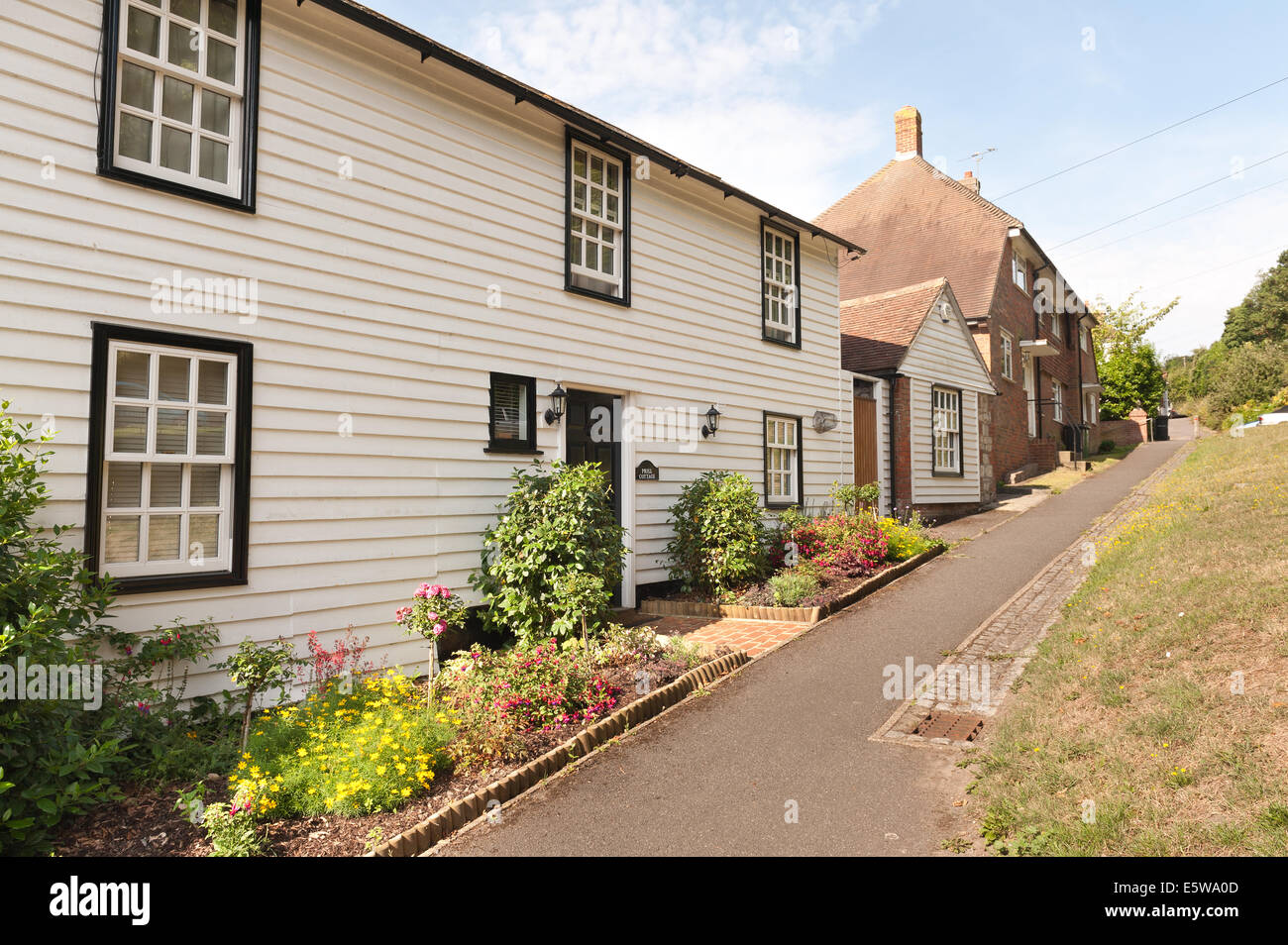 Quaint village streets in Sutton Valence on a typical English summers day showing wooden and handmade hanging tile cladding Stock Photo