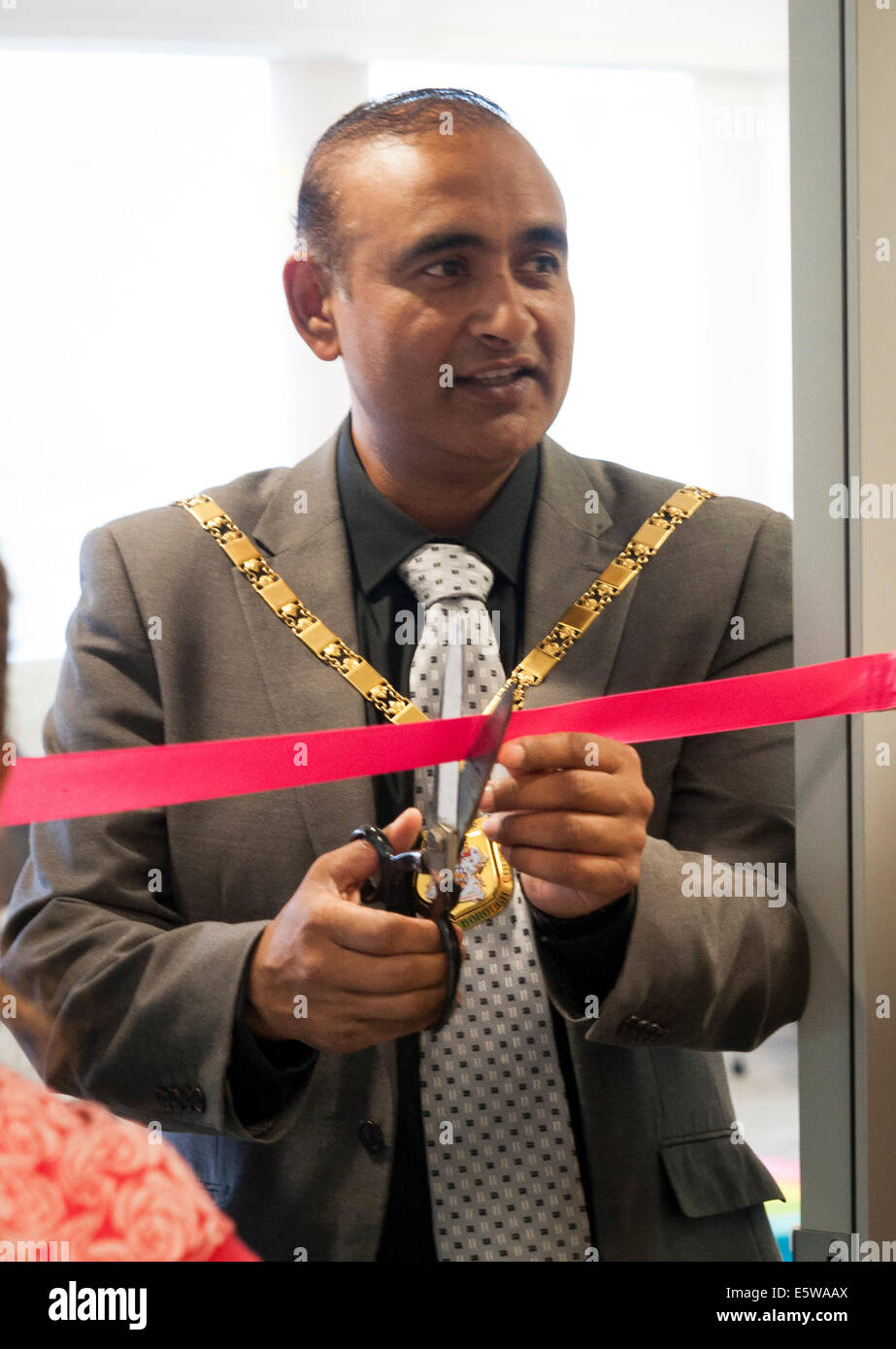 Milton Keynes, UK, 6th Aug 2014. Milton Keynes Mayor Subhan Shafiq cuts