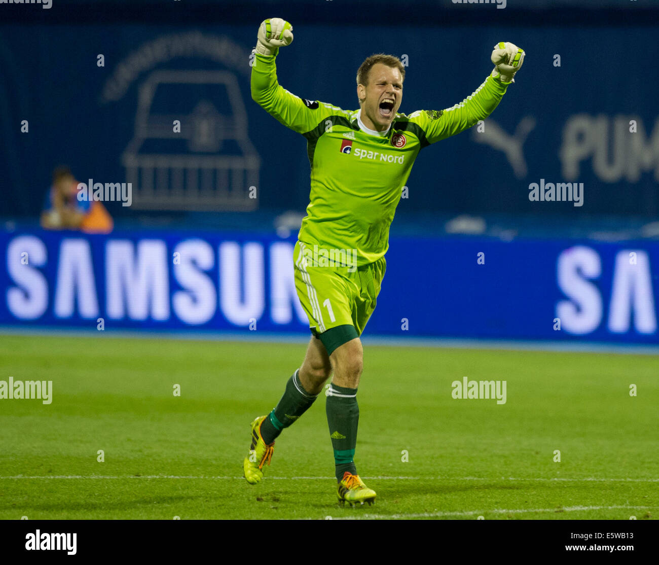 Zagreb, Croatia. 6th Aug, 2014. Goalkeeper Nicolai Larsen of Aalborg celebrates during UEFA Champions League 3rd Qualifying Round soccer match against Dinamo Zagreb at the Maksimir Stadium in Zagreb, Croatia, Aug. 6, 2014. Aalborg won 2-0. Credit:  Miso Lisanin/Xinhua/Alamy Live News Stock Photo