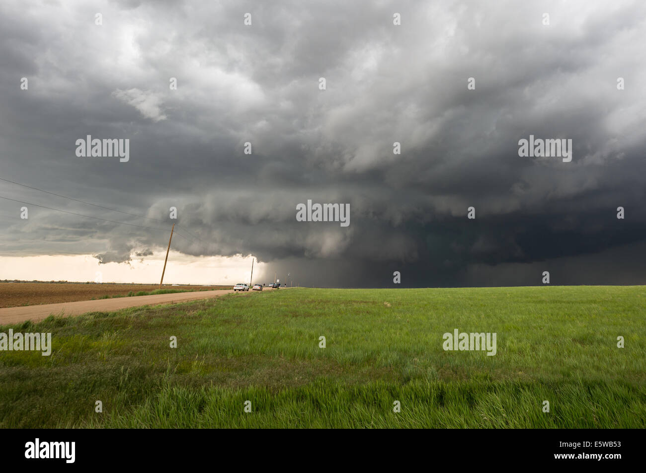 A tornado warned supercell thunderstorm rolls across the plains of ...