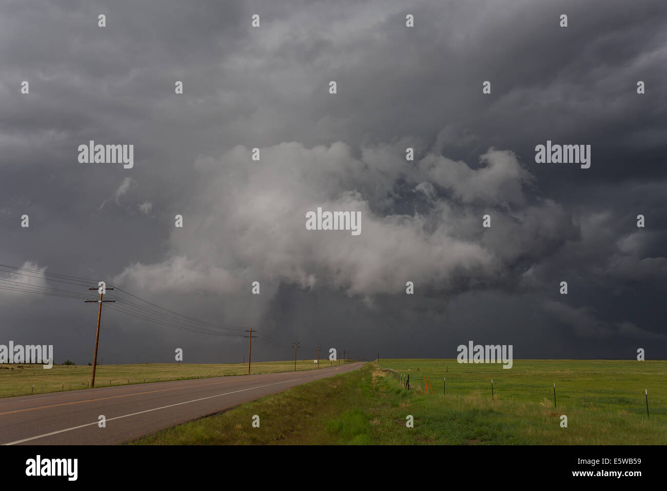 A tornado warned supercell thunderstorm rolls across the plains of ...