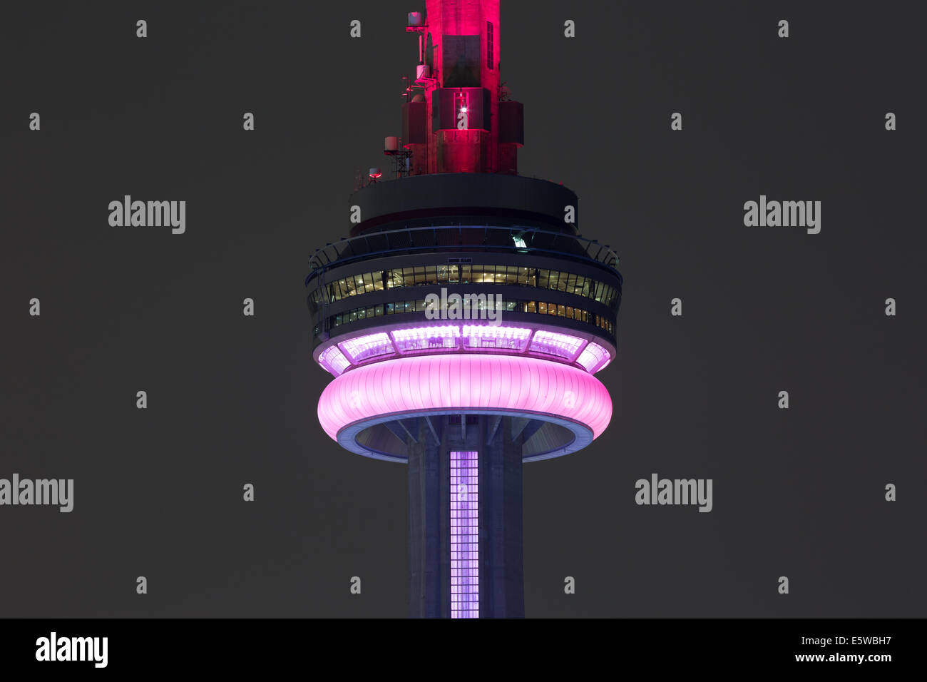 A zoomed in night view of the CN Tower in Toronto, Canada Stock Photo