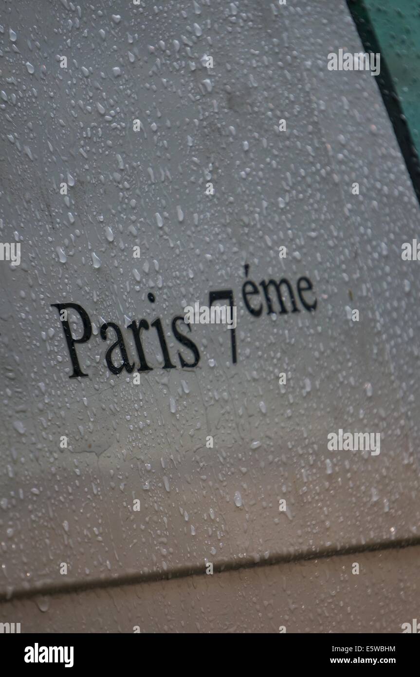 Paris in the rain, the letters of the word Paris on a car door in the rain Stock Photo