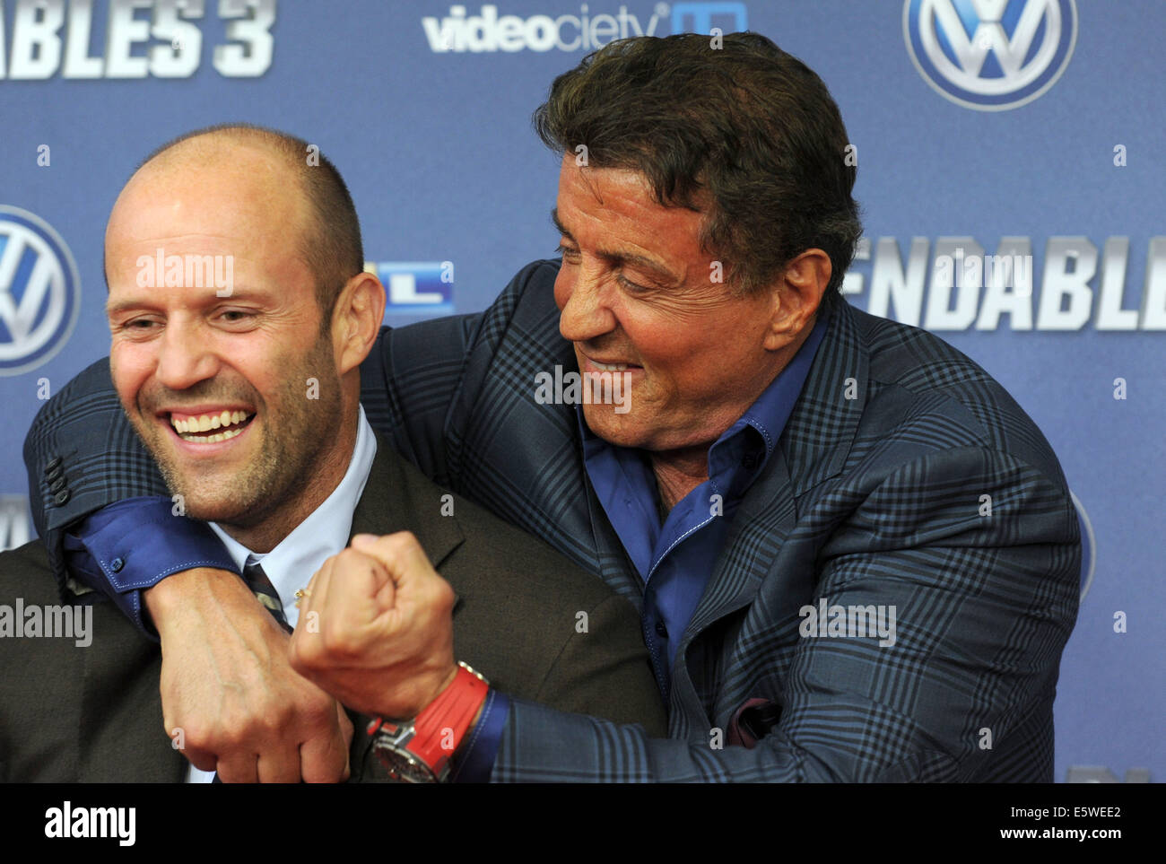 Cologne, Germany. 06th Aug, 2014. Actors Sylvester Stallone (R) and Jason Statham arrive for the premiere of the movie 'The Expendables 3' in Cologne, Germany, 06 August 2014. Photo: CAROLINE SEIDEL/DPA/Alamy Live News Stock Photo