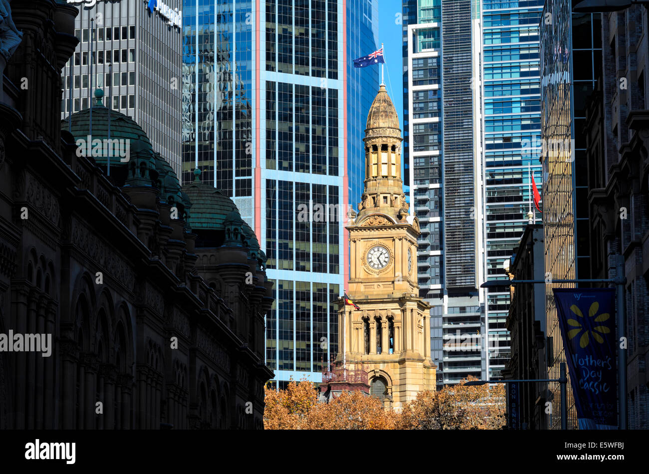 Contrasts between traditional sandstone architecture of Sydney's Town Hall and the modern skyscrapers behind. Sydney, Australia. Stock Photo