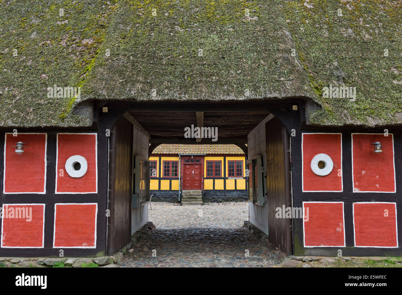 Thatched, red painted half-timbered building, Viking Center Fyrkat, Fyrkat, Hobro, Denmark Stock Photo