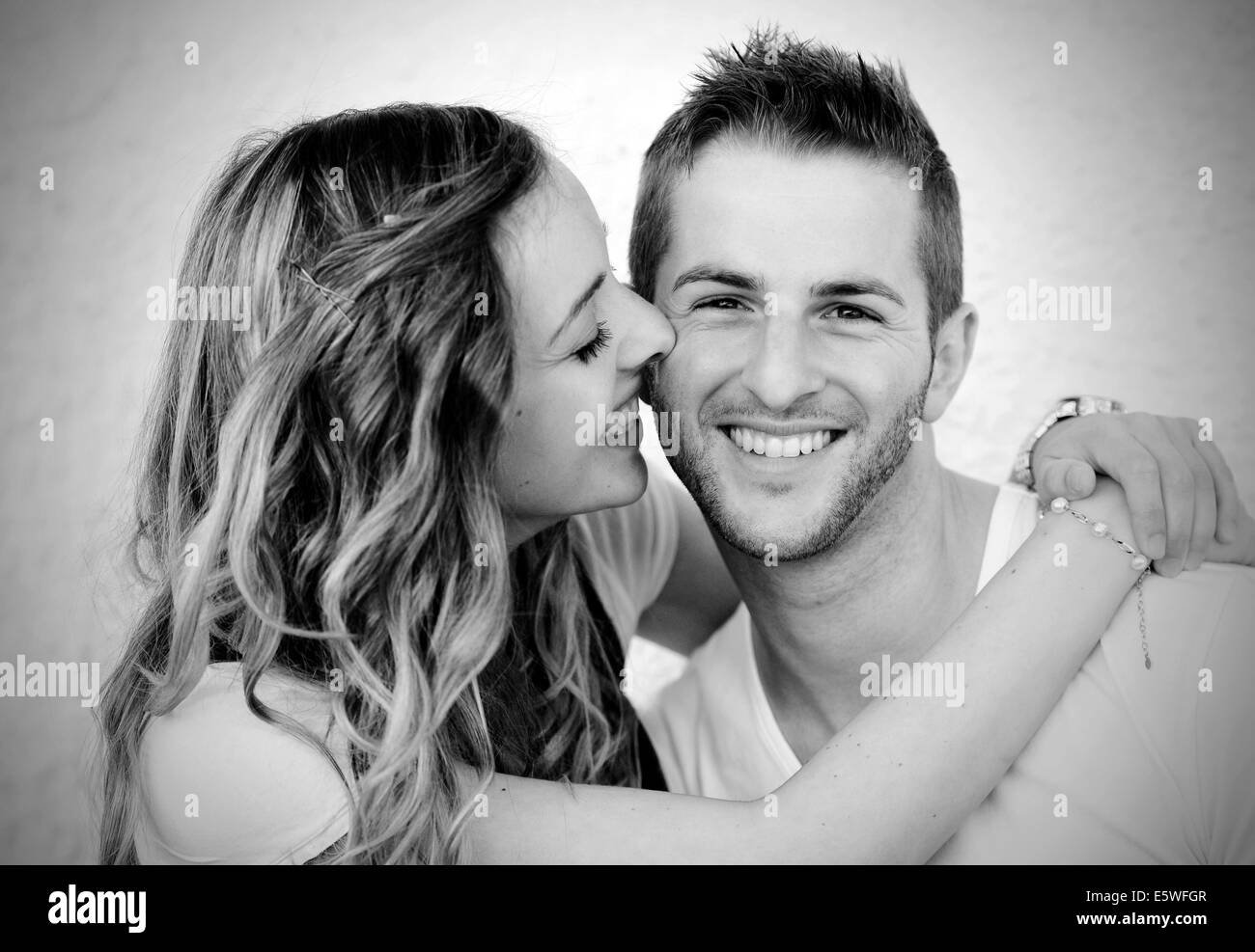 Young man and a young woman, smiling lovers Stock Photo