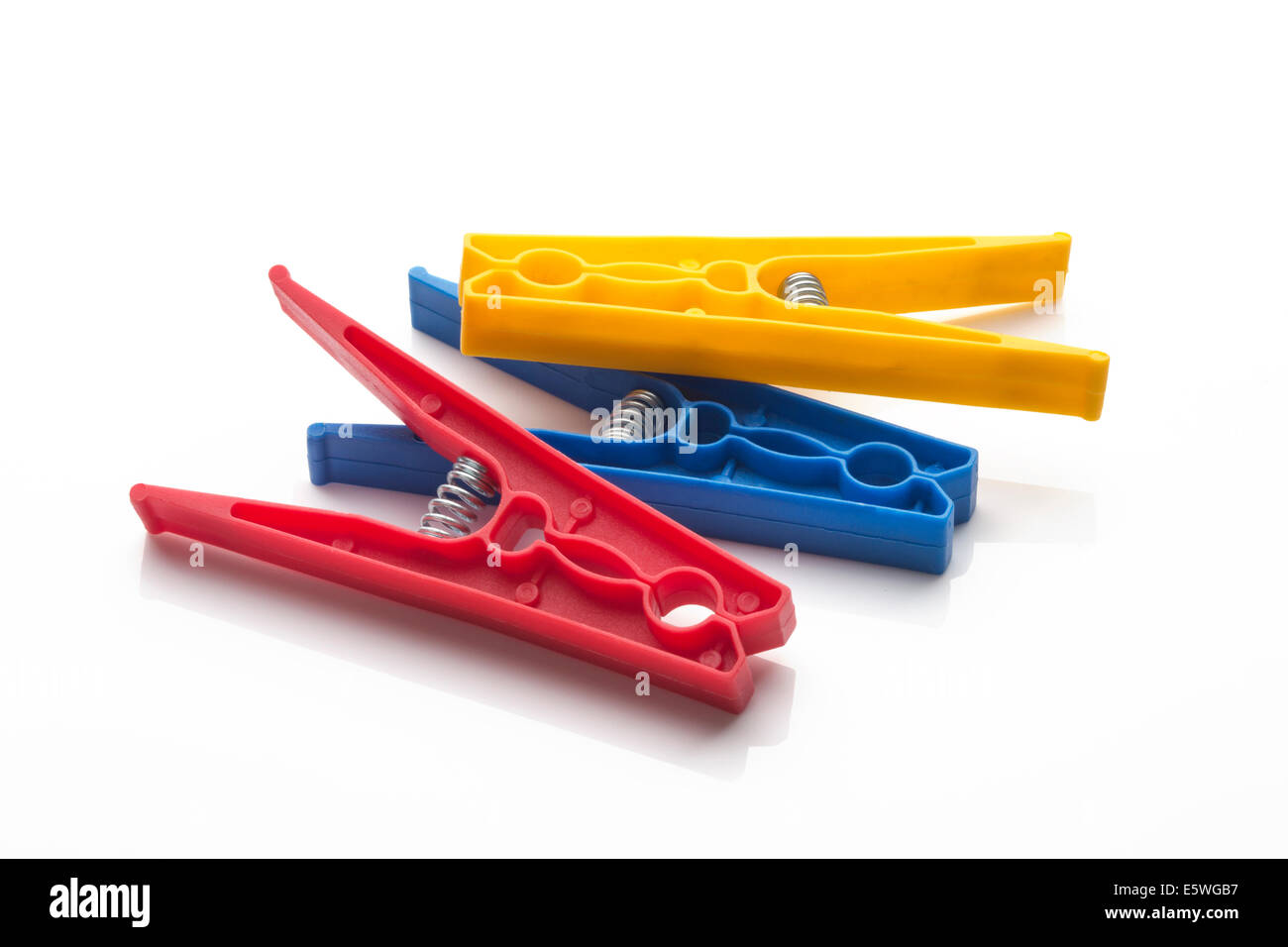 coloured colored plastic clothes pegs Stock Photo