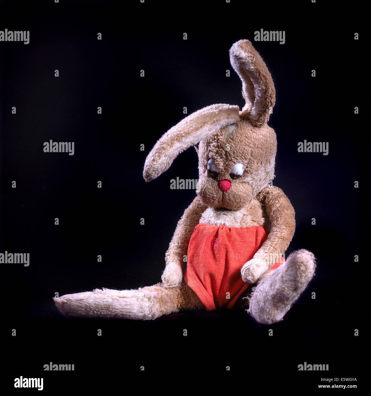 https://c8.alamy.com/comp/E5WGYA/studio-shot-of-old-worn-soft-toy-vintage-brown-rabbit-with-large-droopy-E5WGYA.jpg
