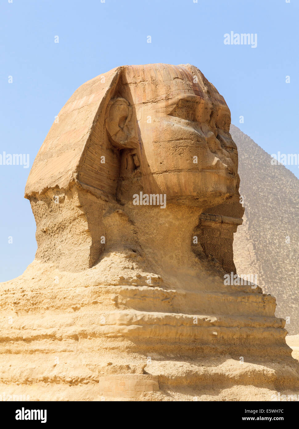 The Sphinx at the Pyramids of Giza in Cairo, Egypt with Great Pyramid in background Stock Photo