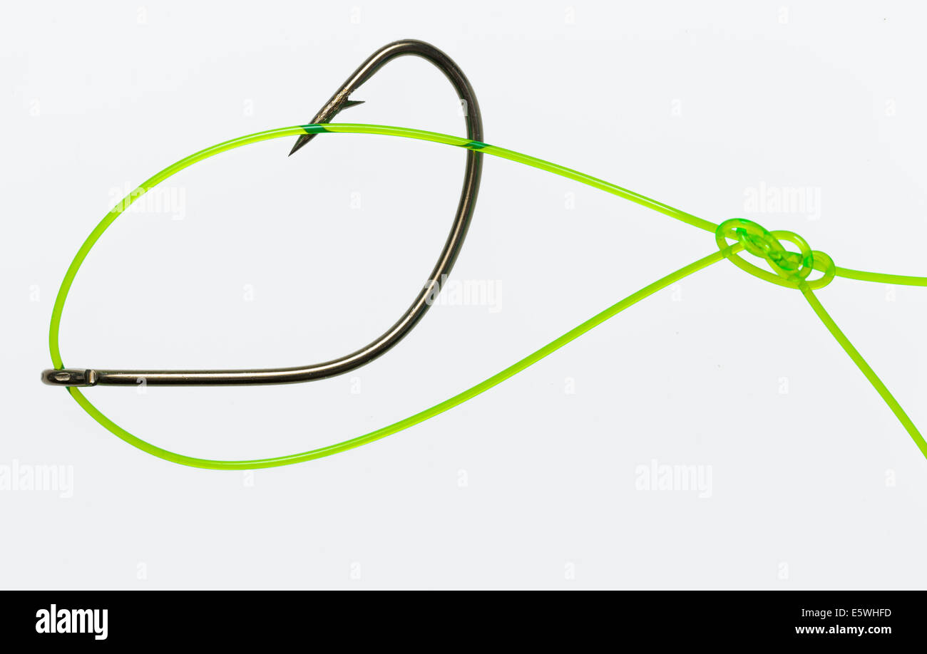 Rapala knot is a terminal loop knot in flourescent monofilament fishing line connected to sharp barbed fishing hook. Stock Photo