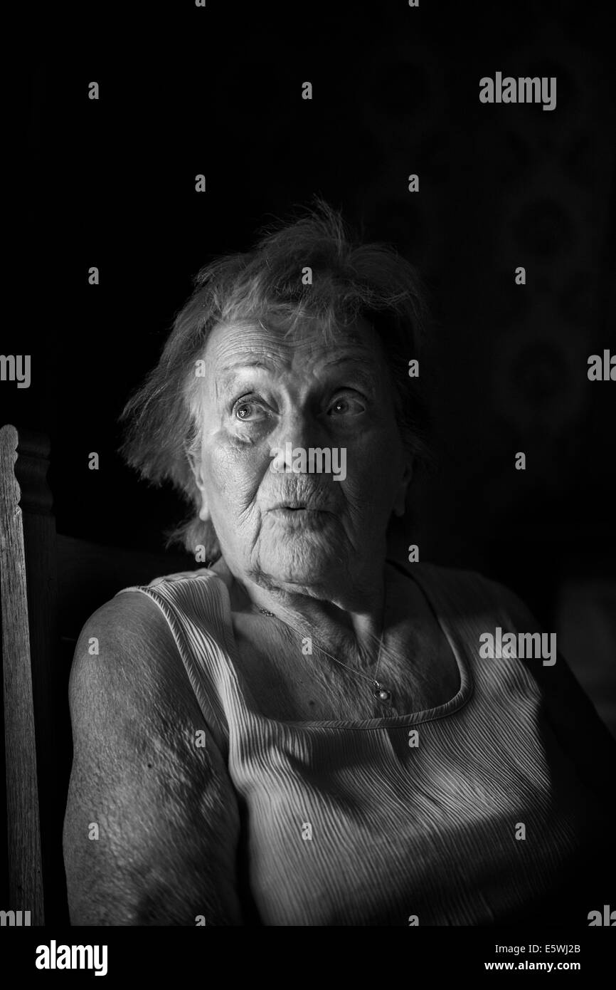 Elderly woman sitting indoors Black and White Stock Photos & Images - Alamy
