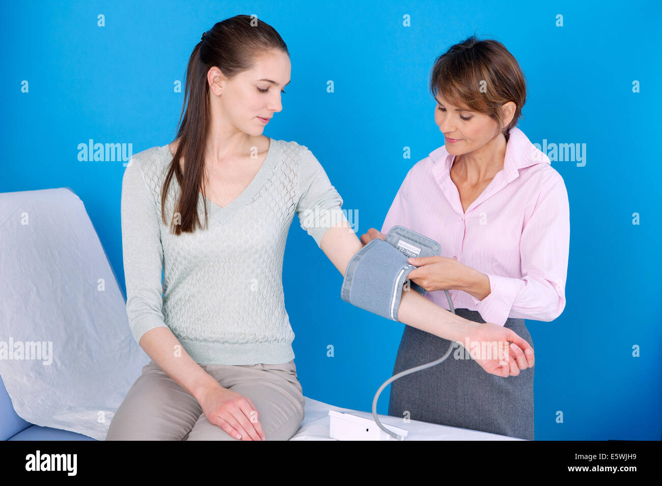 BLOOD PRESSURE, WOMAN Stock Photo